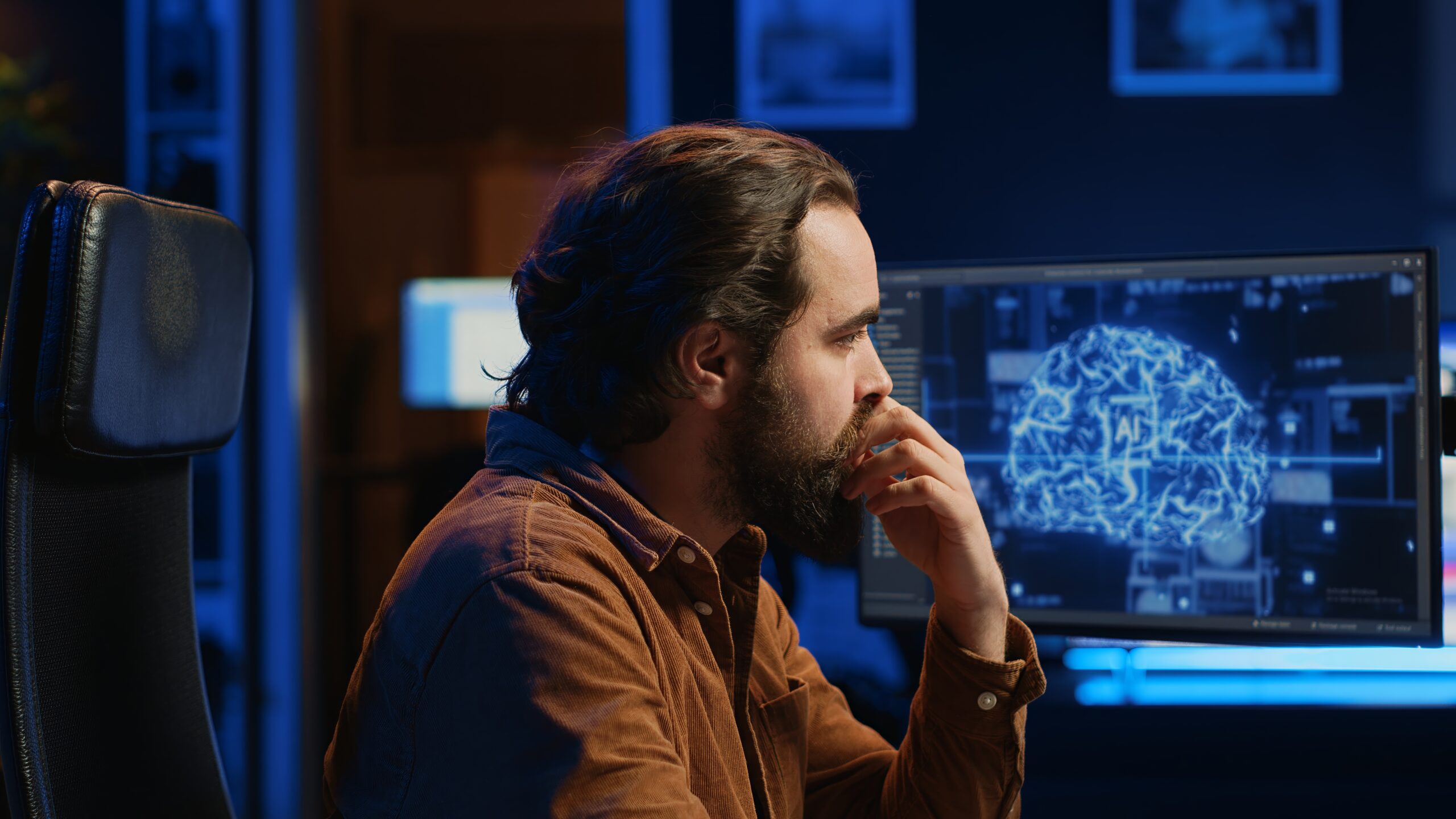 Programmer using computer to update artificial intelligence neural networks, drinking coffee and writing code scripts in home office. IT admin enjoying hot beverage while programming AI, camera A